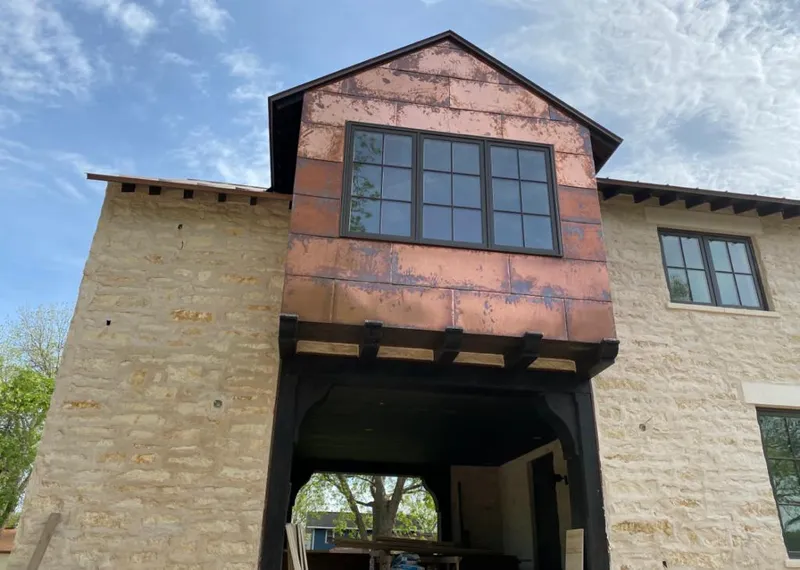Copper metal panel facade on a stone building for Roof Repair in Wahiawa