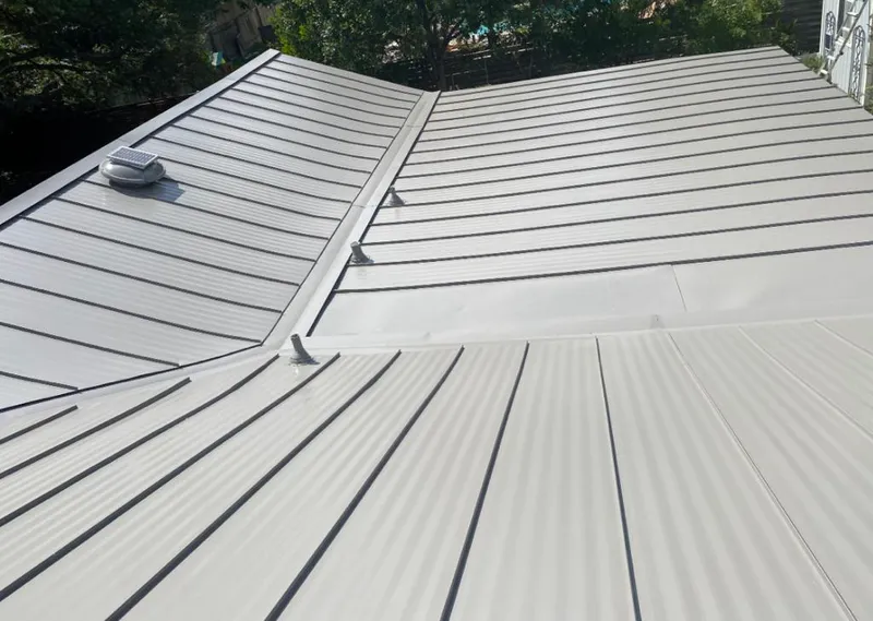 Solar attic fan installed on a metal roof for Roof Ventilation in Wahiawa